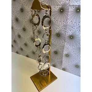 Nine West silver tone ring belt. Fits waists up to 40".